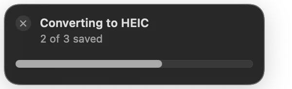 A progress card reading Converting to HEIC, 2 of 3 saved, with a cancel button